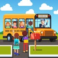 Kids walking to and getting on school bus Royalty Free Stock Photo