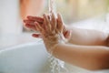 Kids washing hands with liquid soap and water for prevention from covid-19 or coronavirus infection. Clean hands sanitizer protect Royalty Free Stock Photo