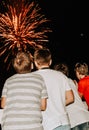 Kids watching fireworks colorful boys backs