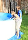 Kids watching into a pool Royalty Free Stock Photo