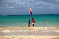 Kids watching sailboat Oahu, Hawaii Royalty Free Stock Photo