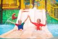 Kids on water slide. Family in aqua theme park Royalty Free Stock Photo