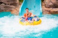 Kids on water slide. Family in aqua theme park Royalty Free Stock Photo