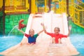 Kids on water slide. Family in aqua theme park Royalty Free Stock Photo