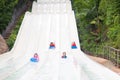 Kids on water slide. Family in aqua theme park Royalty Free Stock Photo