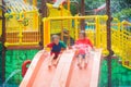 Kids on water slide. Family in aqua theme park Royalty Free Stock Photo