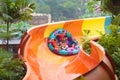 Kids on water slide. Family in aqua theme park Royalty Free Stock Photo