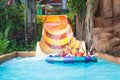 Kids on water slide. Family in aqua theme park Royalty Free Stock Photo