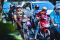 Kids wearing face masks on motorcycles