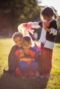 Kids wearing Halloween suits and playing in the park Royalty Free Stock Photo