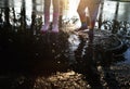 Kids wearing wellingtons in the puddle Royalty Free Stock Photo