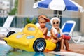 Kids whit infatable toys in pool