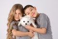 Kids with white dog isolated on gray background. Kids Pet Friendship. Chihuahua