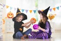 Kids in witch costume on Halloween trick or treat Royalty Free Stock Photo