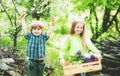 Kids working in volunteer group. Childhood on countryside. Children farmer concept. Happy children farmers working with Royalty Free Stock Photo