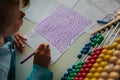 Kids writing and learning numbers, abacus calculation Royalty Free Stock Photo