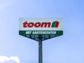 Kiel, Germany - 01. April 2024: A large advertising sign for the Toom DIY chain against a blue sky