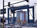 Kiel, Germany - 27.December 2022: A large industrial crane lifts heavy containers with cargo at the port of Kiel in sunny weather