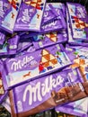 Kiel, Germany - 12 December 2023: Numerous varieties of Milka brand chocolate on a supermarket shelf