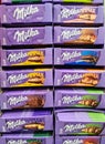 Kiel, Germany - 12 December 2023: Numerous varieties of Milka brand chocolate on a supermarket shelf