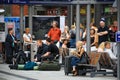 Crowd of European people sitting and standing waiting in platform at Kiel Hauptbahnhof or central train station