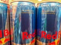 German Red Bull cans in a store in a close up