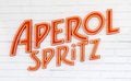 Aperol spritz logo on a white brick wall of bar Royalty Free Stock Photo