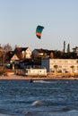 Kitesurfer on the coast of Kiel, Germany against beautiful houses