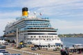 Kiel, Germany - May 19, 2023: Scenic view Costa Firenze cruise liner ship docked car tourist bus parking Oslo quay Kiel