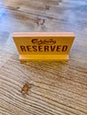 Kiel, Germany - 03 September 2022: A German sign with the inscription reserved for the Carlsberg beer brand on a restaurant table