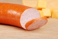 Kielbasa with cheddar cheese in background Royalty Free Stock Photo