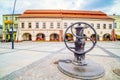 Vintage water pump on town square with Museum of Dialogue of Cultures