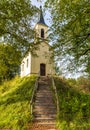 Kiensee chapel with wooden stairs surrounded by trees, Bad Heilbrunn, Bavaria, Germany