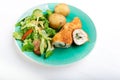 Kiev cutlet with jacket potatoes and salad Royalty Free Stock Photo