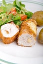 Kiev cutlet with jacket potatoes and salad Royalty Free Stock Photo