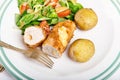 Kiev cutlet with jacket potatoes and salad Royalty Free Stock Photo