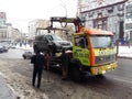 Kiev, March 6, 2018, Ukraine. Traffic police officers on street to pick up intruder`s car on tow truck. Loading tow truck car of Royalty Free Stock Photo