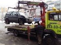 Kiev, March 6, 2018, Ukraine. Traffic police officers on street to pick up intruder`s car on tow truck. Loading tow truck car of Royalty Free Stock Photo