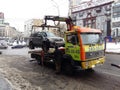 Kiev, March 6, 2018, Ukraine. Traffic police officers on street to pick up intruder`s car on tow truck. Loading tow truck car of Royalty Free Stock Photo