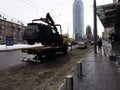 Kiev, March 6, 2018, Ukraine. Traffic police officers on street to pick up intruder`s car on tow truck. Loading tow truck car of Royalty Free Stock Photo