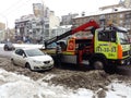 Kiev, March 6, 2018, Ukraine. Traffic police officers on street to pick up intruder`s car on tow truck. Loading tow truck car of Royalty Free Stock Photo