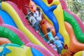 Kiev, Ukraine - August 30, 2015: Children climbing on the inflatable slides