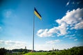 Kiev, Ukraine August 23, 2020: The famous Motherland Monument and the flagpole with the largest flag of Ukraine Royalty Free Stock Photo