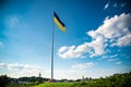 Kiev, Ukraine August 23, 2020: The famous Motherland Monument and the flagpole with the largest flag of Ukraine Royalty Free Stock Photo