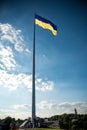 Kiev, Ukraine August 23, 2020: The famous Motherland Monument and the flagpole with the largest flag of Ukraine Royalty Free Stock Photo