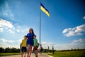 Kiev, Ukraine August 23, 2020: The famous Motherland Monument and the flagpole with the largest flag of Ukraine Royalty Free Stock Photo