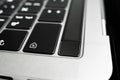 Kiev, Ukraine - August 9, 2022: Fingerprint sensor on macbook pro with touchbar close up. Touch id on apple laptop Royalty Free Stock Photo