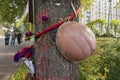 Kiev, Ukraine - August 30, 2016: Helmet on a tree on an improvised monument to those who died during the revolution