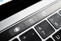 Kiev, Ukraine - August 9,2022: quick view buttons, send file and mark on touch bar apple macbook pro close up. Modern stylish gray
