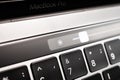 Kiev, Ukraine - August 9, 2022: screen brightness adjustment slider on touch bar apple macbook pro closeup